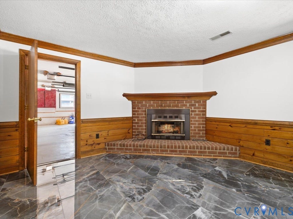 Family room fireplace, door to garage