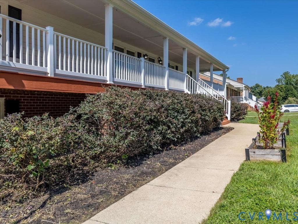 Plantings include blueberries and apple trees