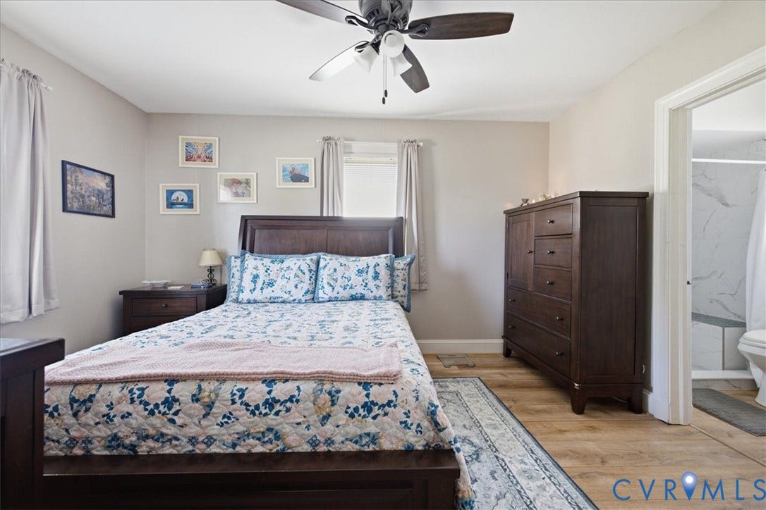 216 Conduit Road, Riverside Park, Colonial Heights, VA 23834 LVP flooring, ceiling fan, neutral paint with adjacent bathroom with tiled shower