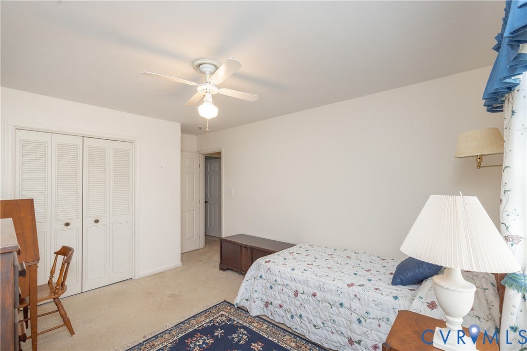 3640 Kiefer Road, Chester, VA 23831 Room featuring neutral wall tones, carpeted flooring, a ceiling fan with light fixture, and bi-fold closet doors