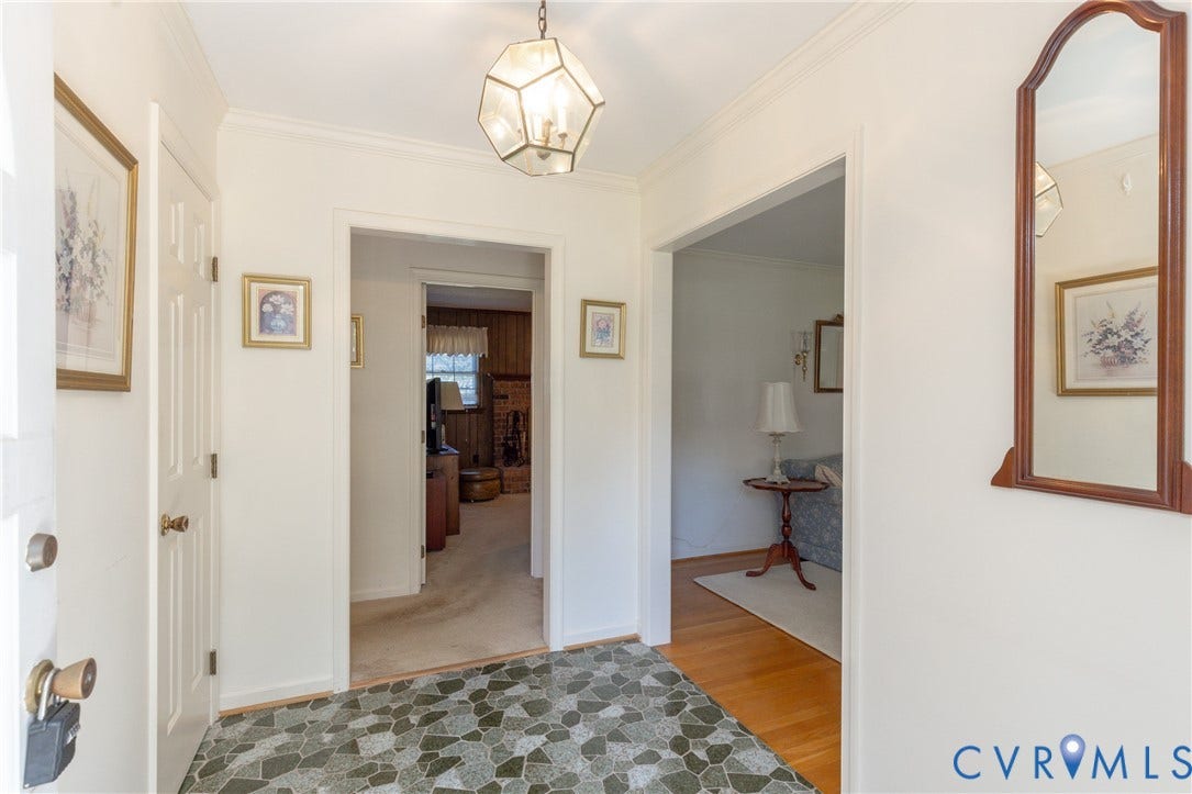 3640 Kiefer Road, Chester, VA 23831 Entryway featuring geometric tile flooring and a decorative ceiling light fixture