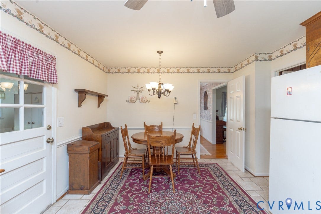 3640 Kiefer Road, Chester, VA 23831 White paneled door with glass inserts, ceramic tile flooring, ceiling fan, and chandelier