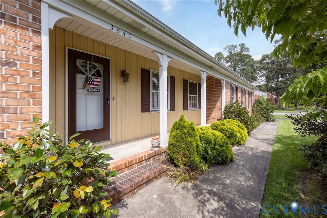3640 Kiefer Road, Chester, VA 23831 Brick exterior with a covered front porch featuring white columns and a concrete walkway