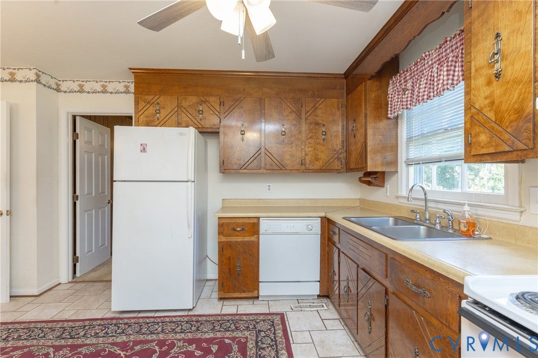 3640 Kiefer Road, Chester, VA 23831 Kitchen featuring wood cabinetry, a double basin stainless steel sink, and a dishwasher