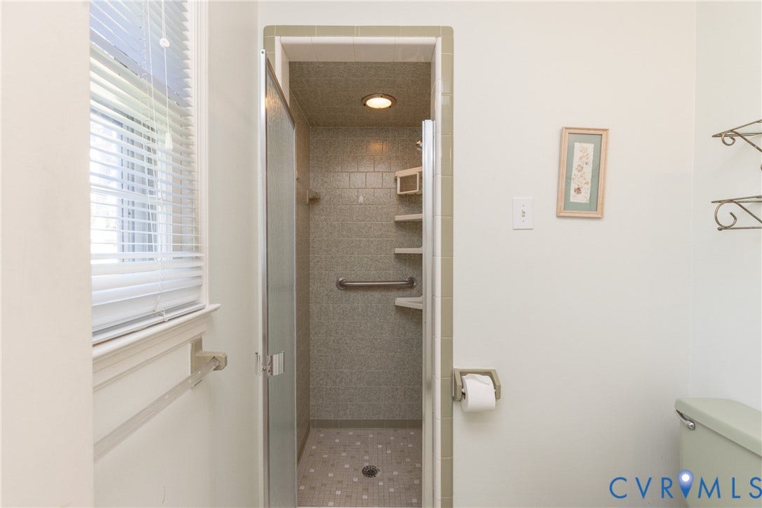 3640 Kiefer Road, Chester, VA 23831 Walk-in shower with glass enclosure, textured wall tiles, recessed lighting, and integrated grab bar