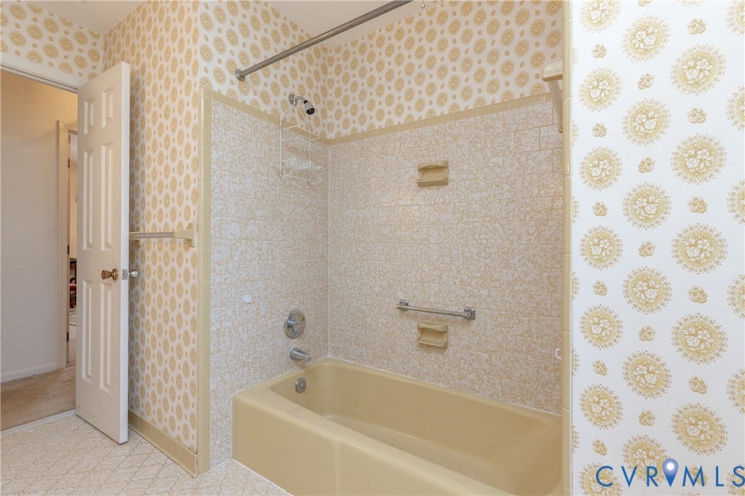 3640 Kiefer Road, Chester, VA 23831 Built-in bathtub with integrated shower, chrome fixtures, and tiled surround
