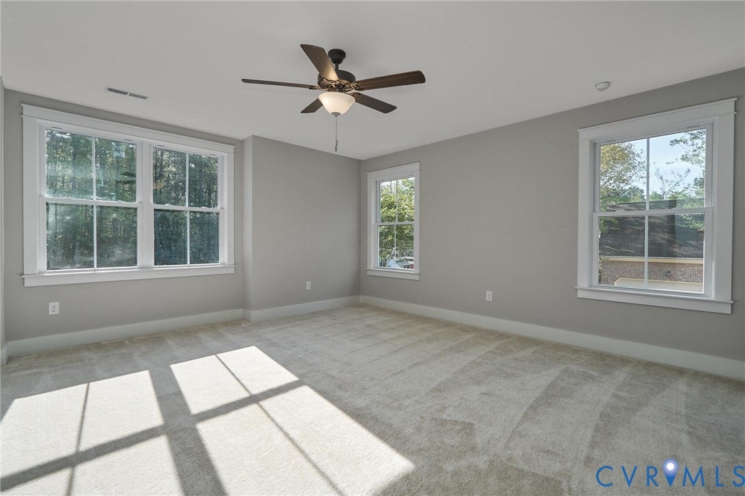 11121 Somerset Hill Drive, Somerset Hills, Glen Allen, VA 23059 Plush carpeting, neutral wall tones, multiple windows with white trim, and a ceiling fan with integrated lighting