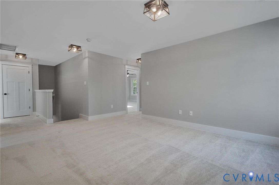 11121 Somerset Hill Drive, Somerset Hills, Glen Allen, VA 23059 Spacious room featuring light gray walls, plush carpeting, white trim, white paneled doors, and contemporary ceiling light fixtures
