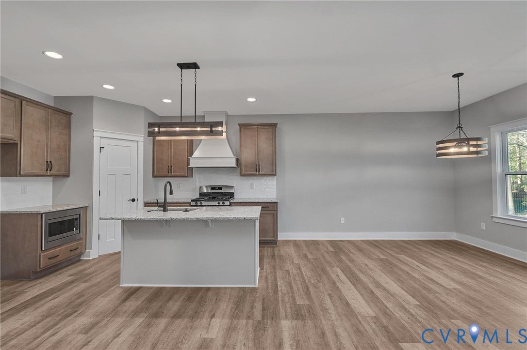 11121 Somerset Hill Drive, Somerset Hills, Glen Allen, VA 23059 Spacious kitchen and dining area featuring wood-finish flooring, recessed lighting, and a kitchen island with sink