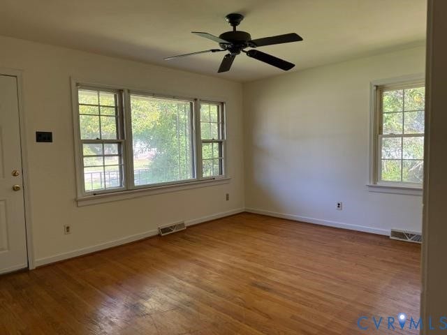 2109 Parkside Avenue, Lakeside, Henrico, VA 23228 Wood-finish flooring with multiple windows, a ceiling fan, and white painted walls