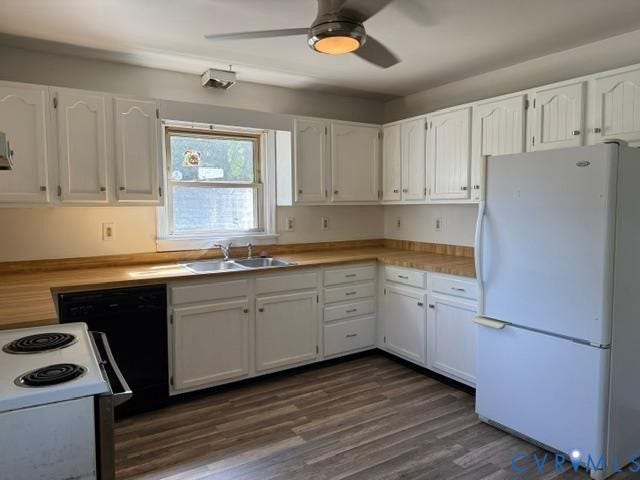 2109 Parkside Avenue, Lakeside, Henrico, VA 23228 Kitchen featuring white cabinetry, wood-finish countertops, stainless steel double-basin sink, and wood-finish flooring