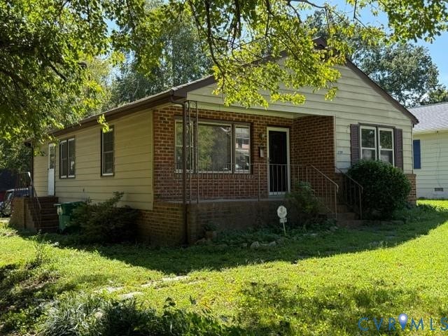 2109 Parkside Avenue, Lakeside, Henrico, VA 23228 Brick and siding exterior with a covered front porch and metal railings