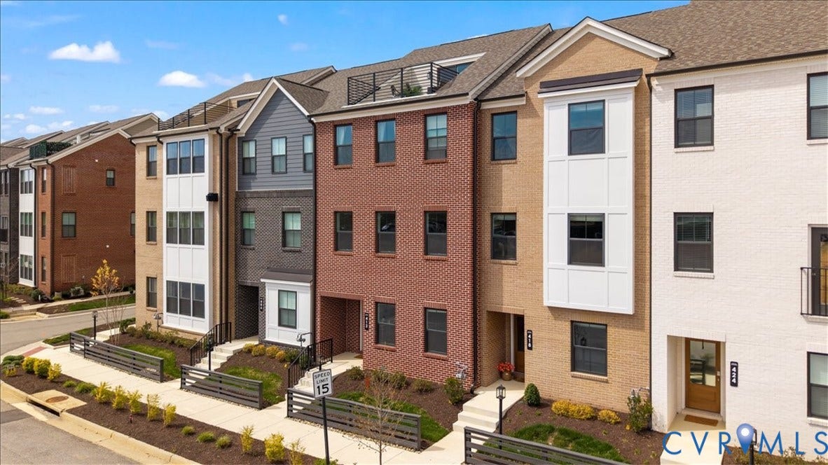 412 Quiet Breeze Alley, Chesterfield, VA 23113 Contemporary townhomes featuring brick and siding exteriors, multi-story bay windows, and private roof terraces