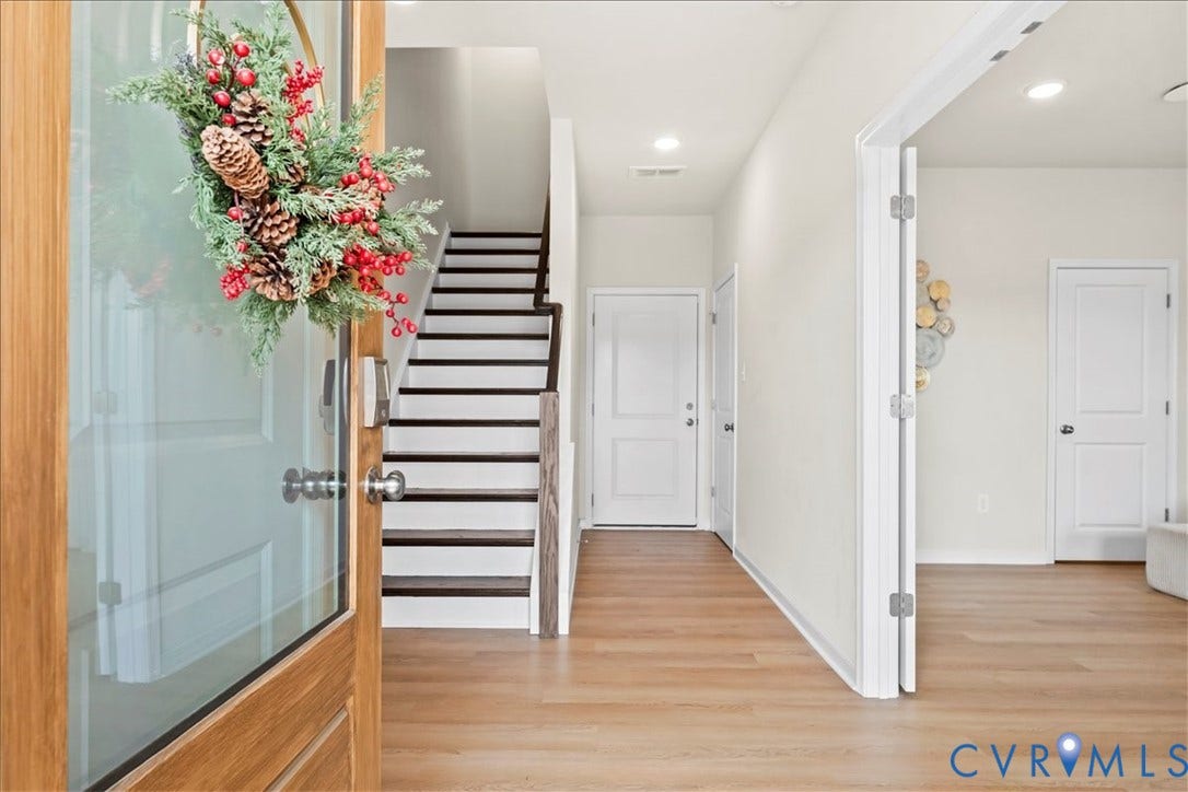 412 Quiet Breeze Alley, Chesterfield, VA 23113 Wood-finish flooring throughout the entry, recessed lighting, and a wood-frame entry door with a glass panel