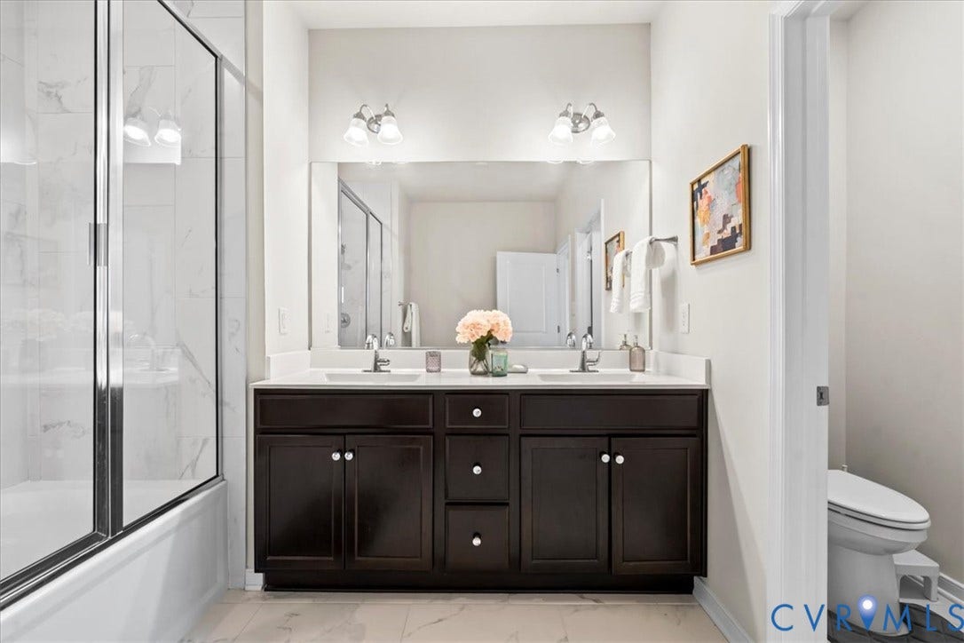 412 Quiet Breeze Alley, Chesterfield, VA 23113 Dual vanity with undermount sinks and dark wood cabinetry