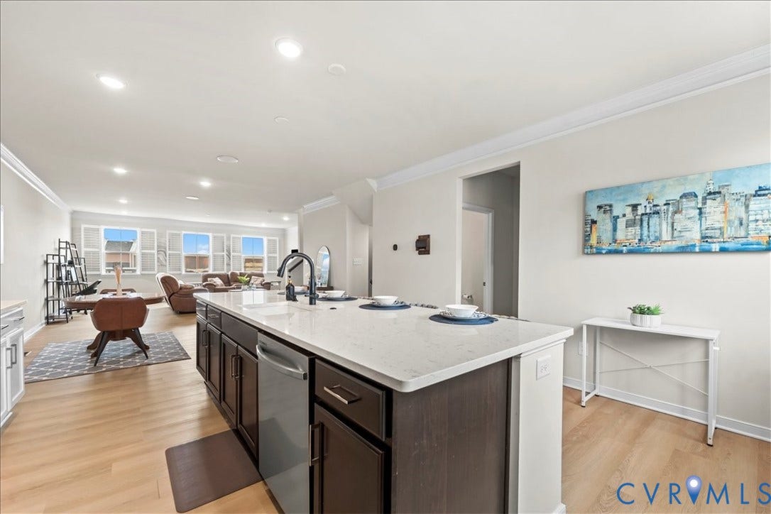 412 Quiet Breeze Alley, Chesterfield, VA 23113 Kitchen island with integrated sink, stainless steel dishwasher, and stone countertop
