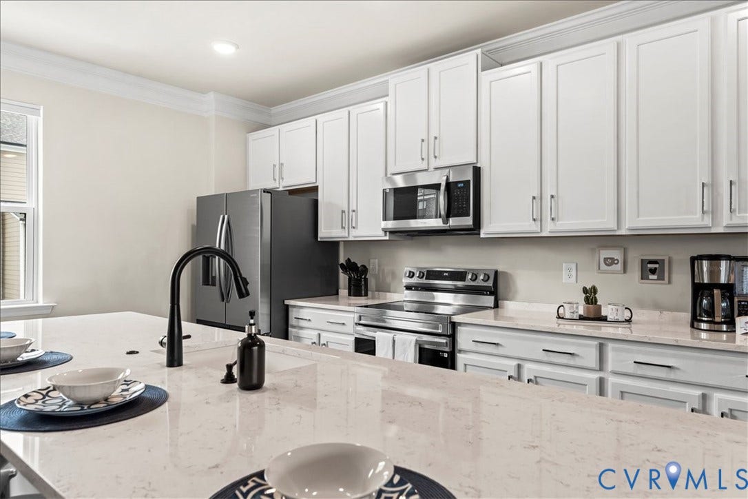 412 Quiet Breeze Alley, Chesterfield, VA 23113 Kitchen featuring white shaker cabinetry, stainless steel appliances, light-toned countertops, a matte black gooseneck faucet, and recessed lighting