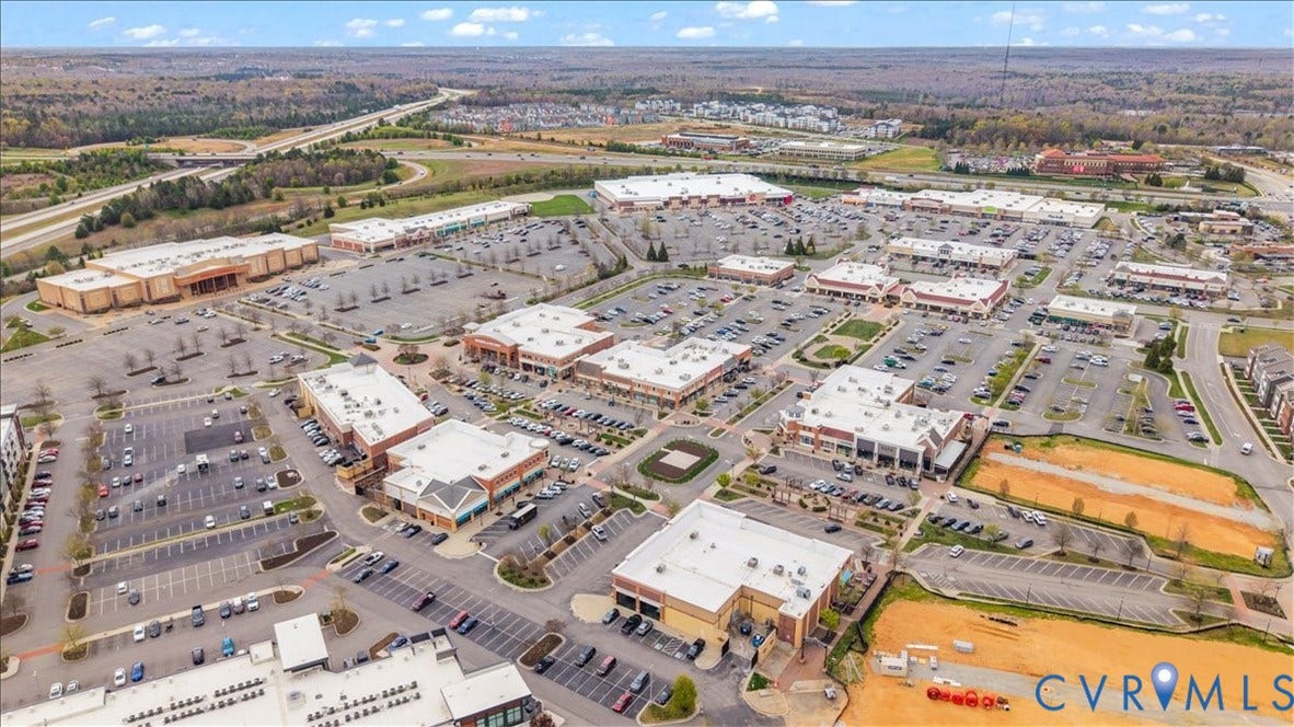 412 Quiet Breeze Alley, Chesterfield, VA 23113 Expansive retail development featuring multiple commercial buildings, abundant surface parking, and direct highway access