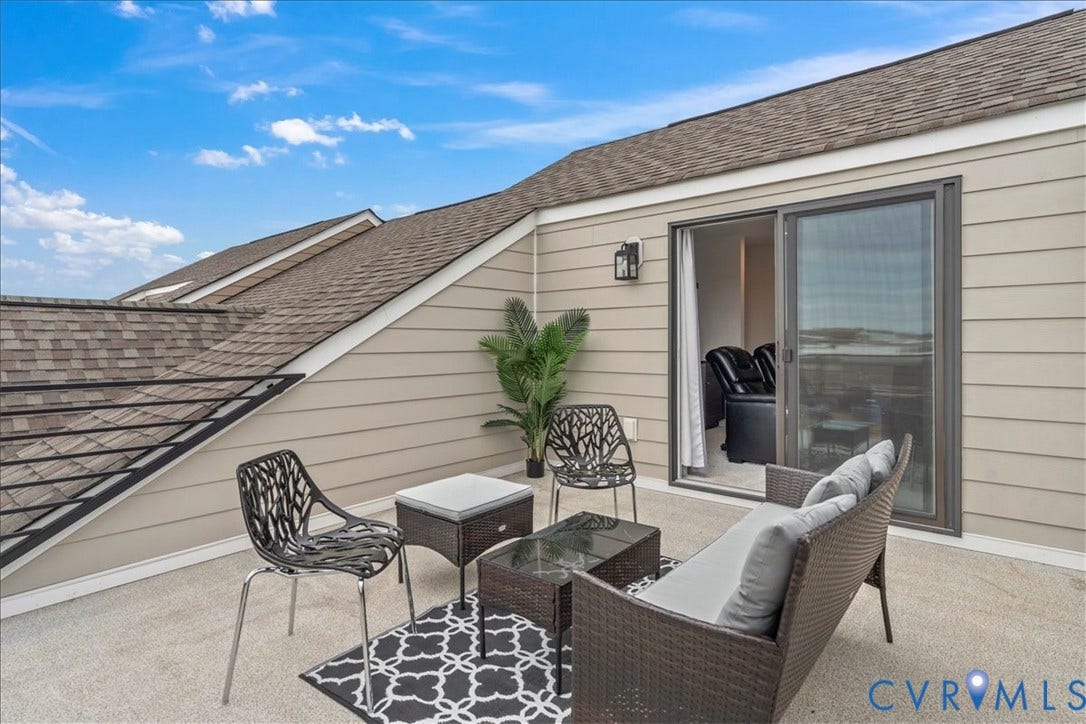 412 Quiet Breeze Alley, Chesterfield, VA 23113 Exterior deck with a sliding glass door, horizontal siding, and an outdoor wall sconce