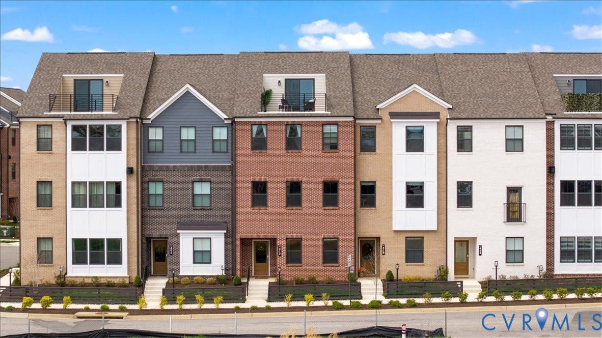 412 Quiet Breeze Alley, Chesterfield, VA 23113 Multi-story facade featuring varied brick and siding, multiple windows, balconies, and individual entryways