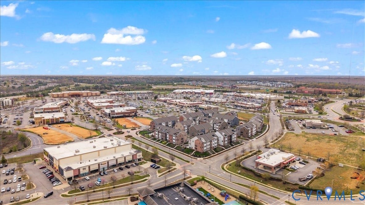 412 Quiet Breeze Alley, Chesterfield, VA 23113 Aerial perspective showcasing a multi-building commercial and residential area with extensive parking facilities