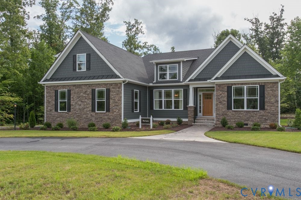 Stone and shingle exterior with dark siding