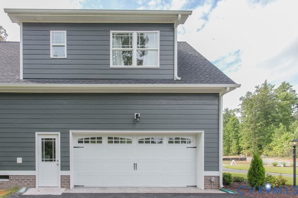 Gray horizontal siding with white trim
