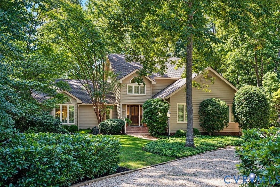 13001 River Hills Drive, Midlothian, VA 23113 Thoughtfully designed and custom built by the original owners with local builder Mike Dumont, this distinctive home blends beautifully with its wooded James River West setting.
