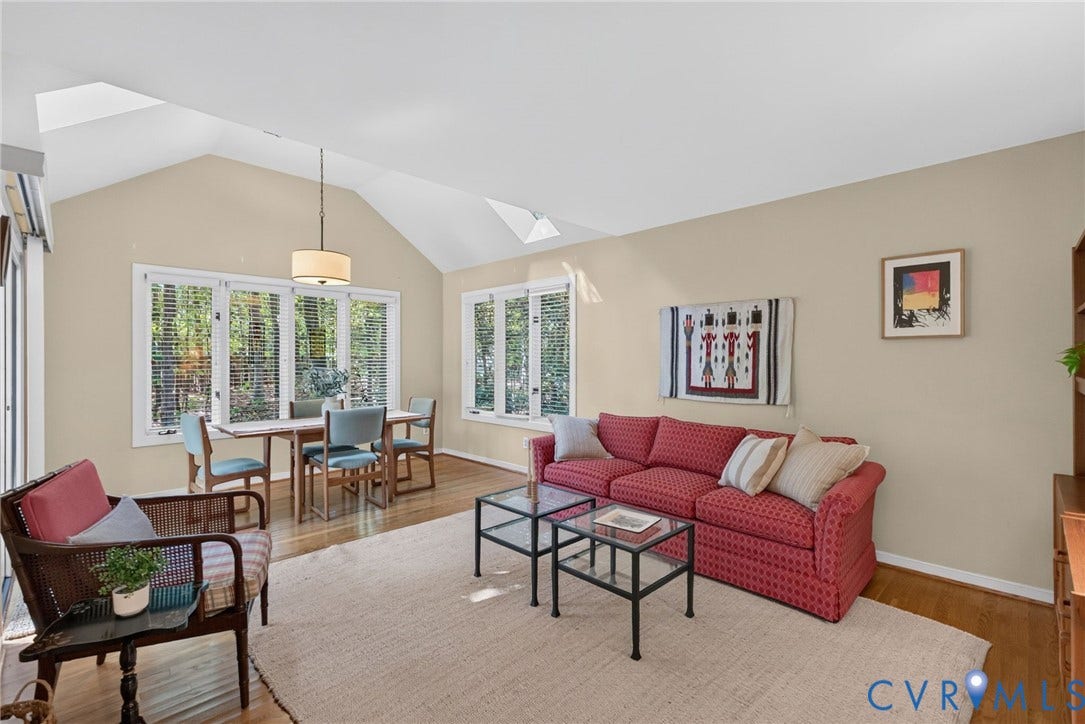 13001 River Hills Drive, Midlothian, VA 23113 Bright family room with hardwood floors, vaulted ceiling, and abundant natural light.