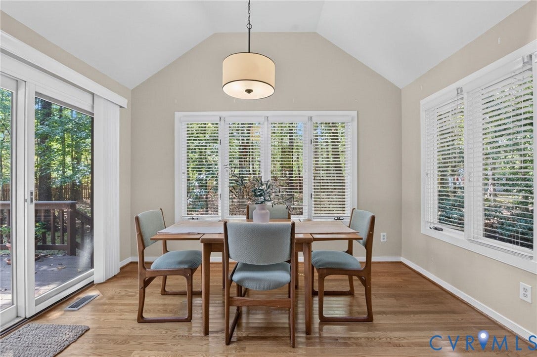 13001 River Hills Drive, Midlothian, VA 23113 Casual dining area surrounded by windows and wooded views.
