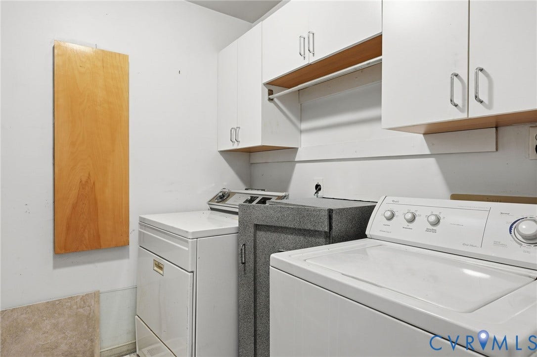 3211 Regatta Pointe Court, Brandermill, Midlothian, VA 23112 Built-in ironing board, cabinetry, washer/dryer. Gray cabinet contained stereo equipment -- accessible from family room on the other side of this wall.