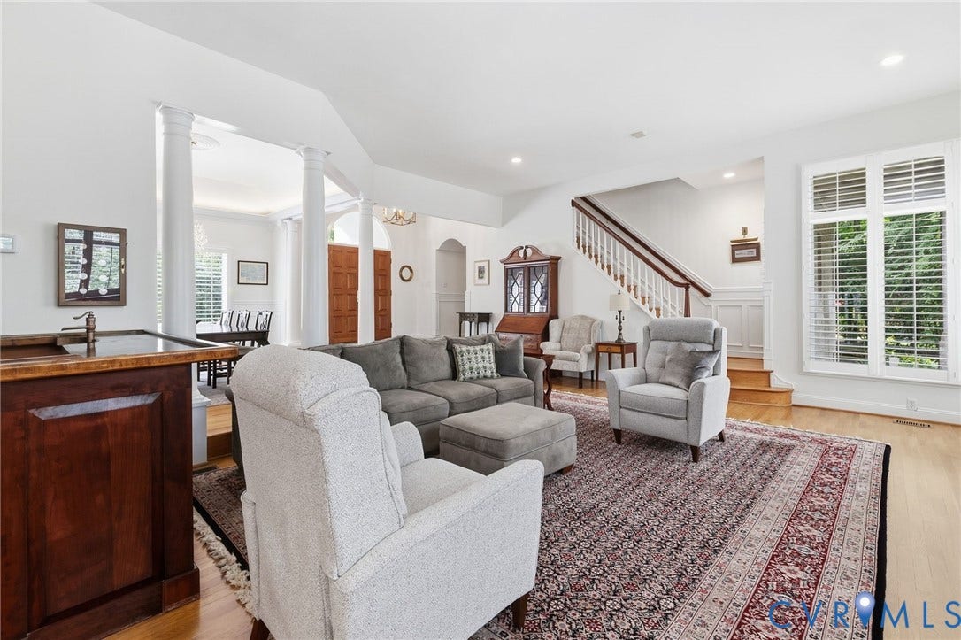 17 Quail Run Drive, Manakin Sabot, VA 23103 Living Room with hardwood floors, plantation shutters, and bar