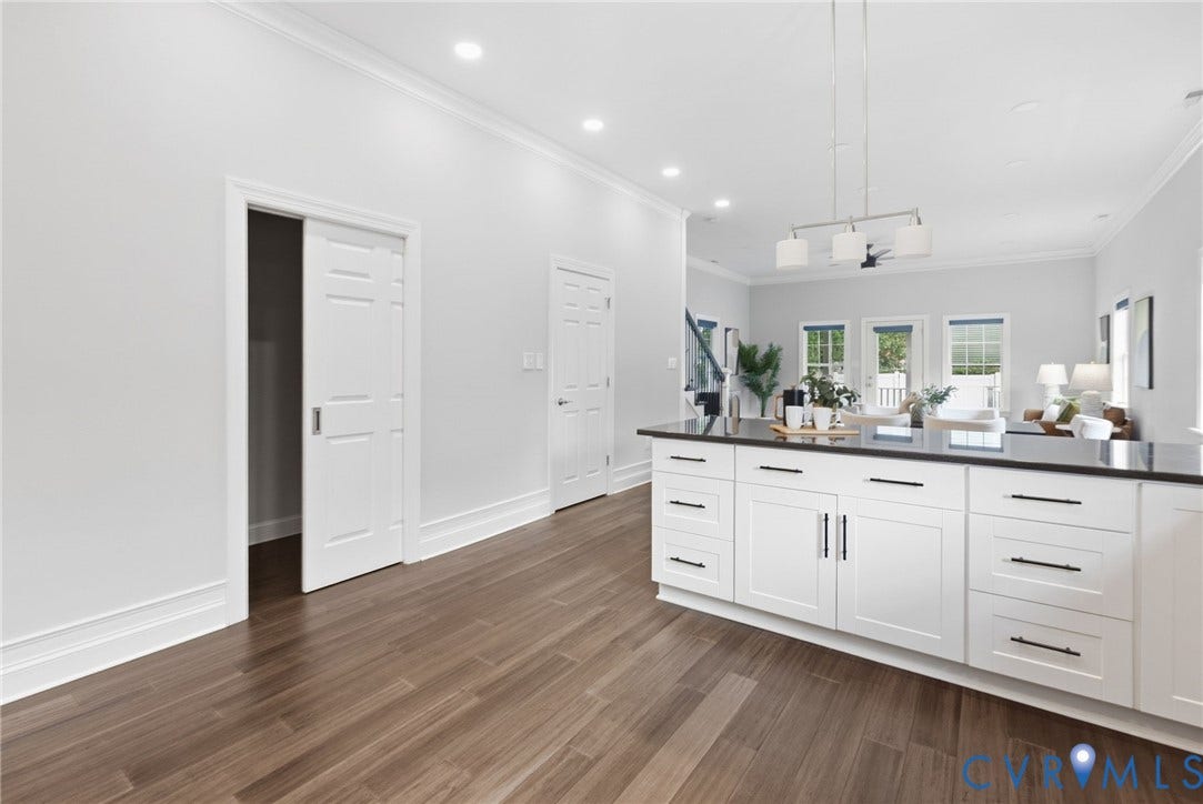 2002 Fairmount Avenue, Church Hill, Richmond, VA 23223 Kitchen island with white cabinetry and dark countertops