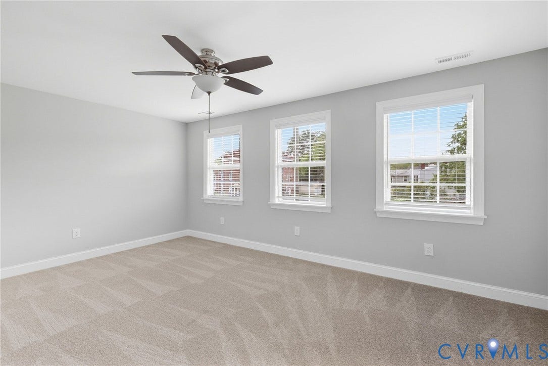 2002 Fairmount Avenue, Church Hill, Richmond, VA 23223 Triple windows with blinds, ceiling fan with light fixture, and neutral carpeting