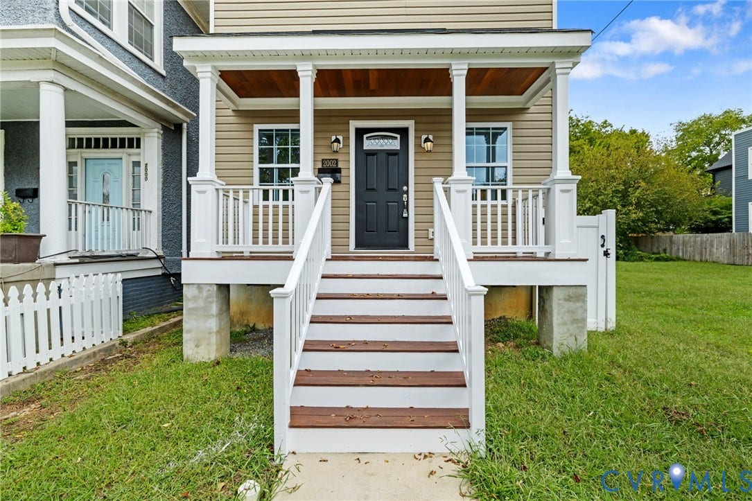 2002 Fairmount Avenue, Church Hill, Richmond, VA 23223 Front porch featuring white columns and railing, wood-finish ceiling, and a dark entry door
