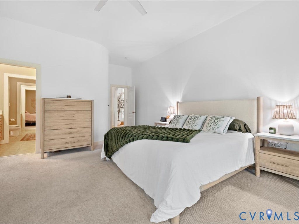 147 Oyster Cove Landing, Hartfield, VA 23071 White painted walls, neutral carpet, and a ceiling fan
