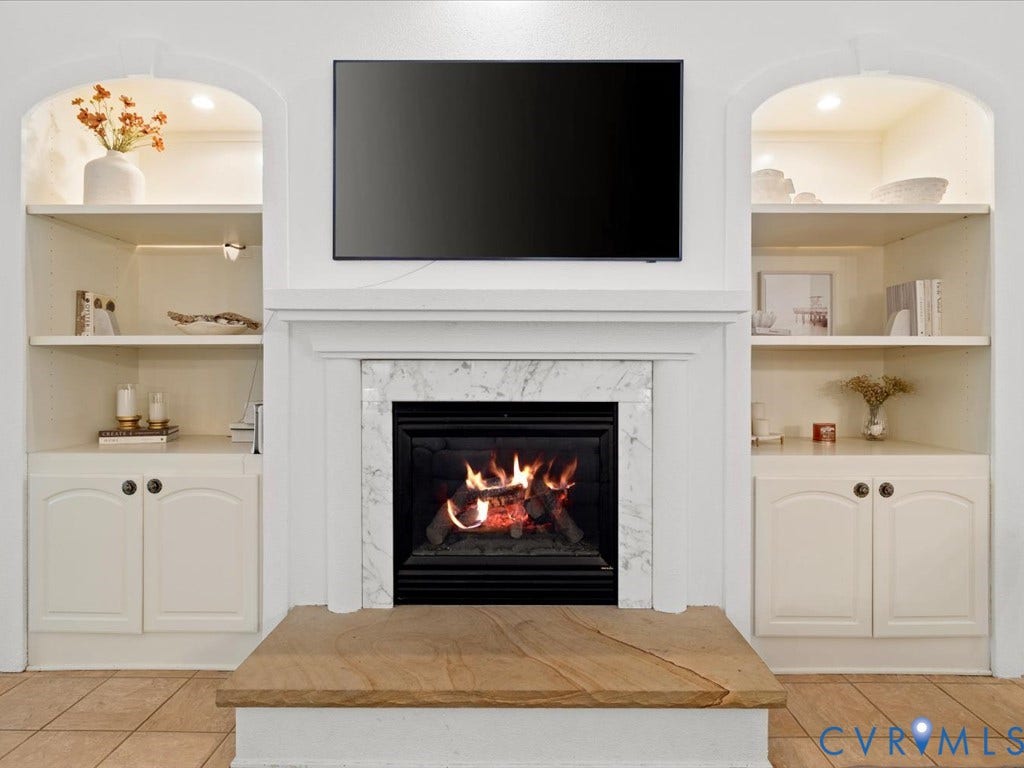 147 Oyster Cove Landing, Hartfield, VA 23071 Fireplace featuring a marble surround, wood mantle, and stone hearth