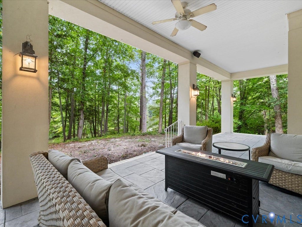 147 Oyster Cove Landing, Hartfield, VA 23071 Expansive outdoor patio with ceiling fan, recessed lighting, and a built-in fire pit