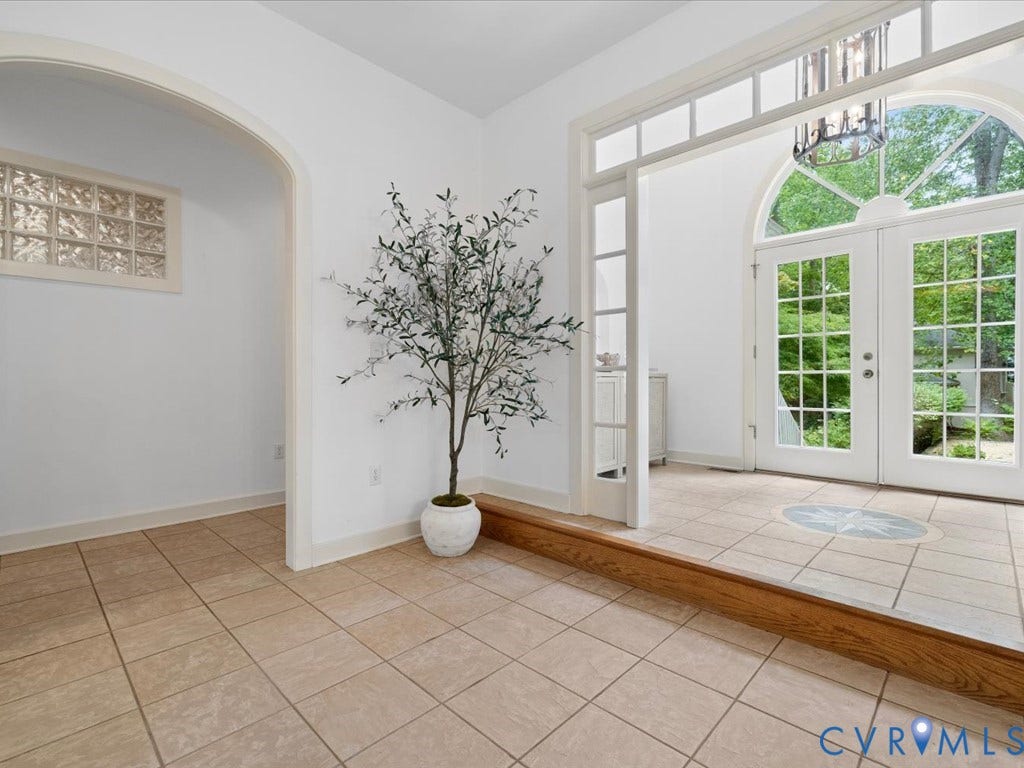147 Oyster Cove Landing, Hartfield, VA 23071 Tiled flooring entry with arched doorway, glass block window, and dual paneled doors