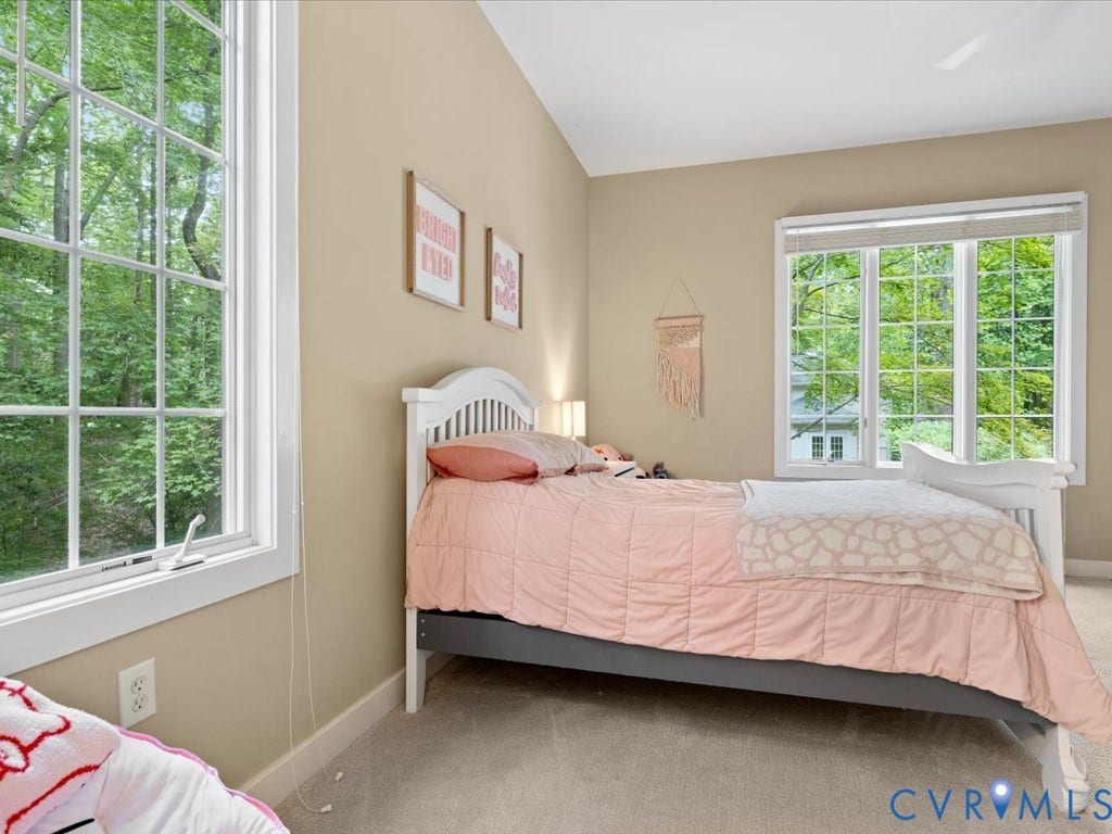 147 Oyster Cove Landing, Hartfield, VA 23071 Multiple grid-pattern windows, neutral wall tones, and light-toned carpeting
