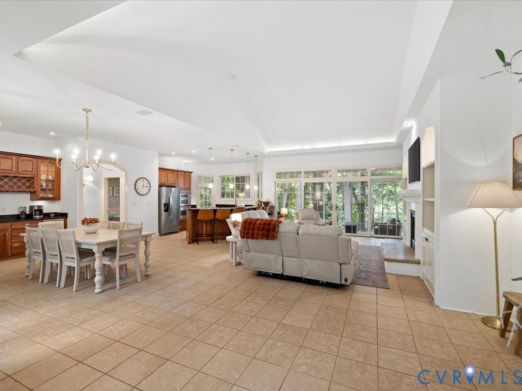 147 Oyster Cove Landing, Hartfield, VA 23071 Recessed lighting, arched doorway, tile flooring, built-in shelving, and large glass paneled doors