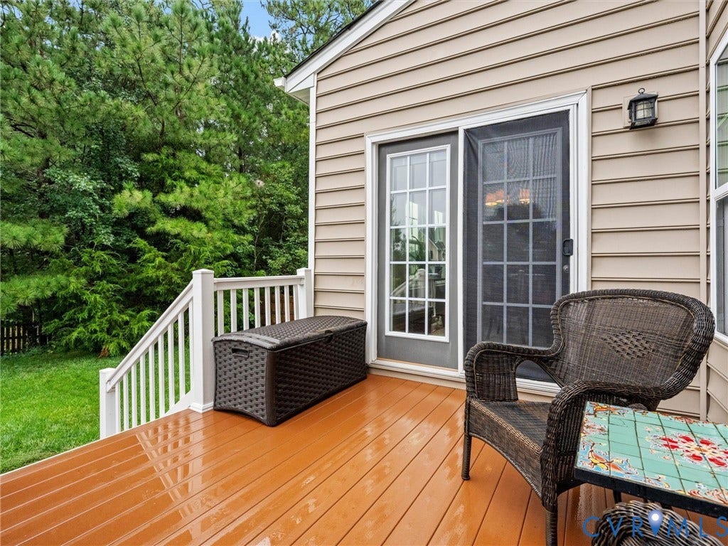 9990 Orchard Meadow Road, Mechanicsville, VA 23116 Deck with wood-finish flooring, white railing, and sliding glass door