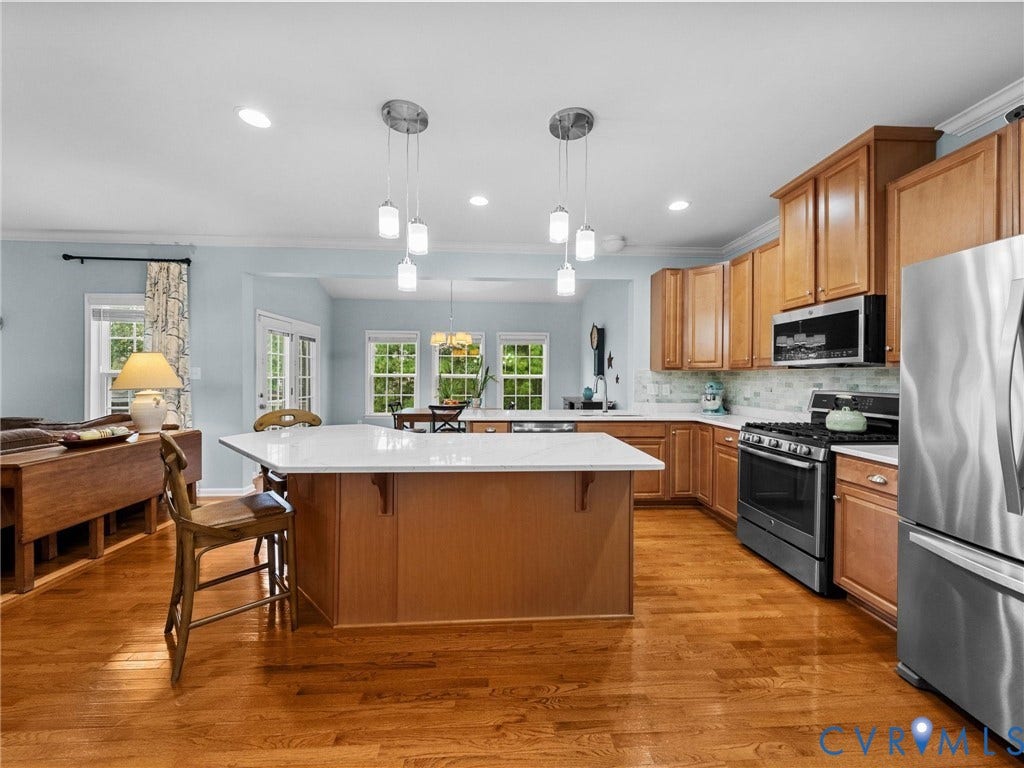 9990 Orchard Meadow Road, Mechanicsville, VA 23116 Hardwood flooring, wood-finish cabinetry, stainless steel appliances, central island with solid surface countertop, and recessed lighting