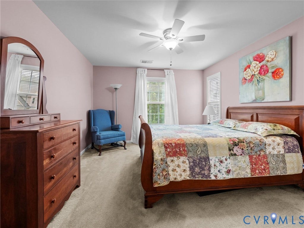9990 Orchard Meadow Road, Mechanicsville, VA 23116 Soft pink walls, window with blinds, overhead ceiling fan, and light-colored carpeting