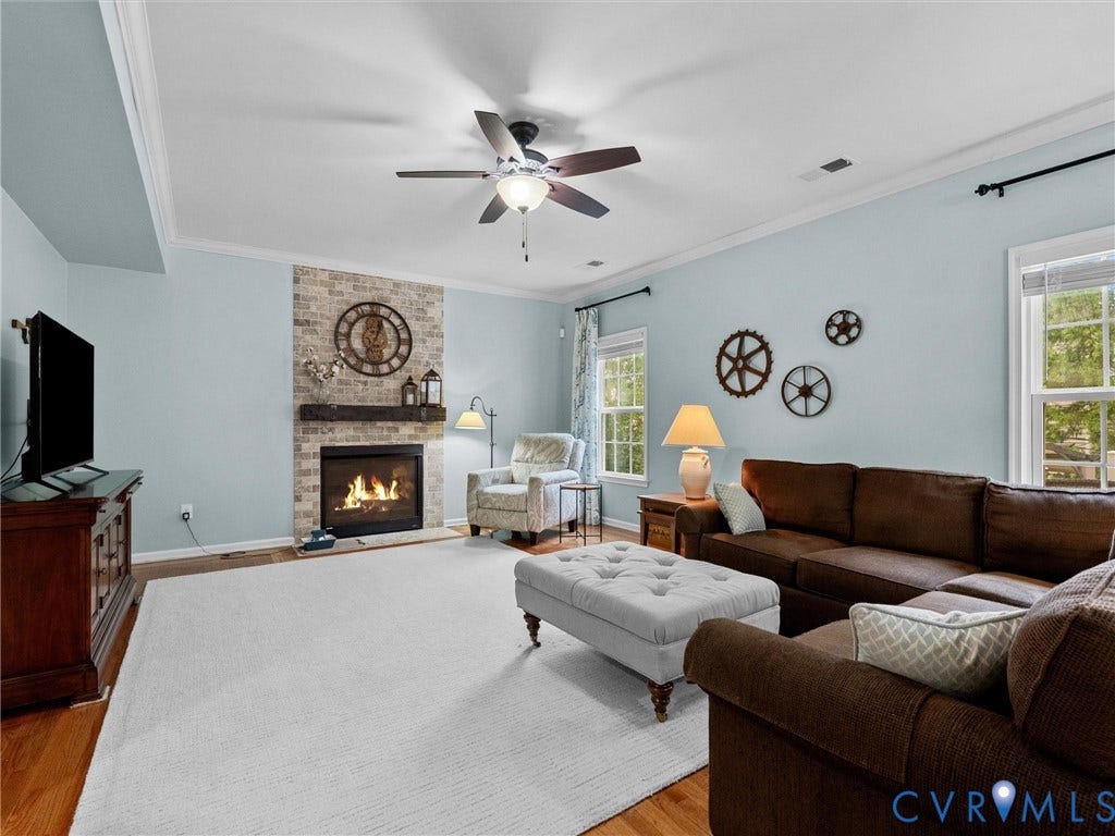 9990 Orchard Meadow Road, Mechanicsville, VA 23116 Brick-faced fireplace with a wood mantel