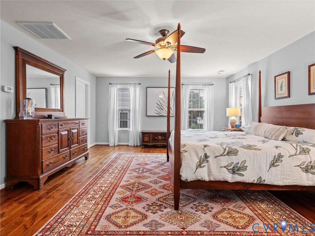 9990 Orchard Meadow Road, Mechanicsville, VA 23116 Hardwood-finish flooring, recessed lighting, and a ceiling fan with integrated lighting
