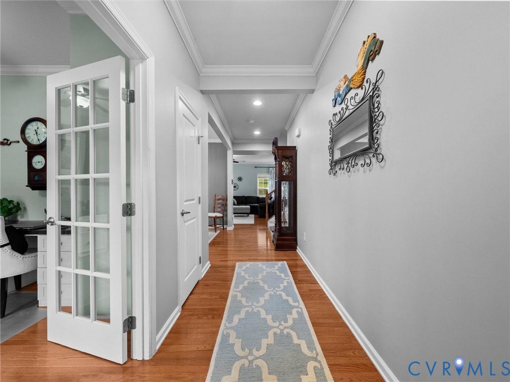 9990 Orchard Meadow Road, Mechanicsville, VA 23116 Hardwood-style flooring, French doors, recessed lighting, crown molding, and a built-in storage closet