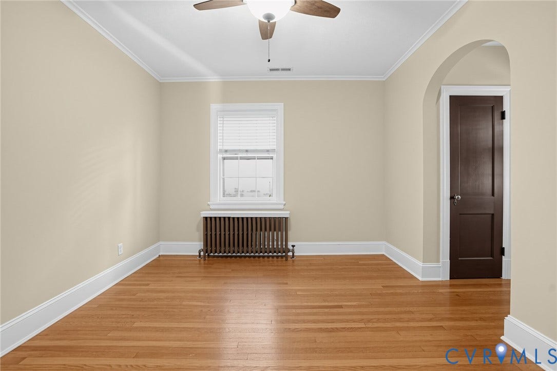 1713 Wilmington Avenue, Richmond, VA 23227 Hardwood flooring throughout, crown molding, and an arched doorway