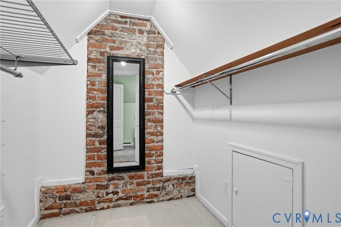 1713 Wilmington Avenue, Richmond, VA 23227 Exposed brick wall feature with an integrated full-length mirror