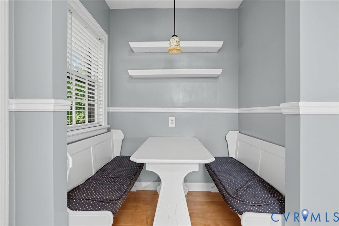 1713 Wilmington Avenue, Richmond, VA 23227 Built-in bench seating with panel detailing, wood-finish flooring, and crown molding